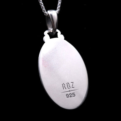 Reverse side of the oval, Gothic Judaica sterling silver Chai pendant, showing a highly polished, engravable surface. Engraved at the bottom are the maker's mark 'RBZ' and the '925' silver hallmark.