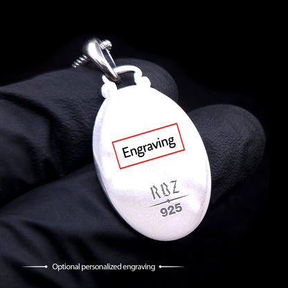 Polished reverse side of the Gothic Judaica sterling silver Chai pendant held in a black-gloved hand, featuring a red box graphic indicating optional personalized engraving space above the RBZ and 925 hallmarks.