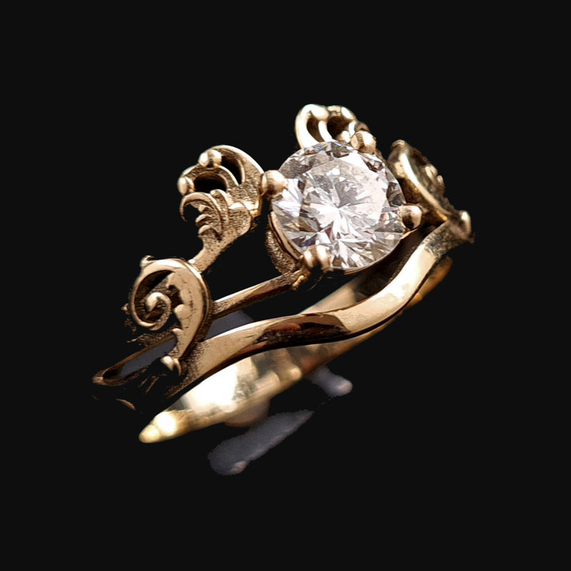 Custom-made fancy diamond engagement ring featuring a delicate, acanthus-like floral design, crafted from yellow 14K gold by RBZ Jewelry.