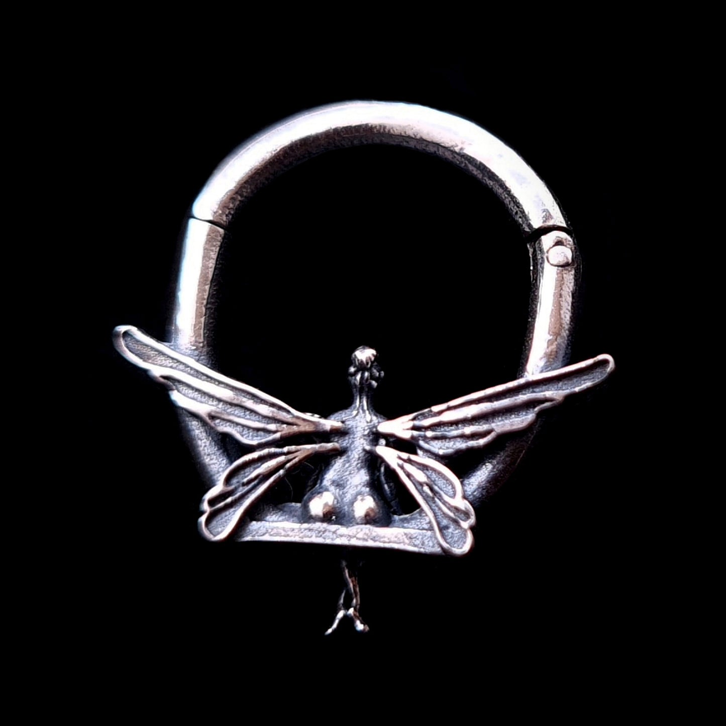 Back view of 925 sterling silver fairy clicker septum ring showing the detailed back of the fairy's body and wing textures