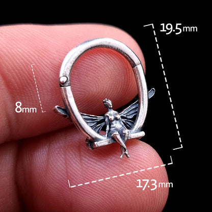 Solid 925 sterling silver fairy septum clicker shown from the front with dimension markings: 19.5mm total height, 17.3mm total width, and 8mm internal hoop space. Held between fingers to show scale.