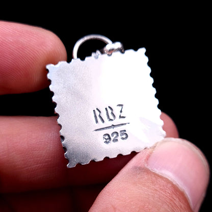 Reverse side of the Bicycle Day blotter pendant, showing the clean sterling silver finish and the RBZ hallmark
