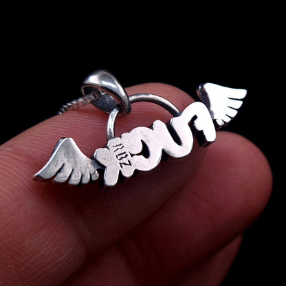 Back view of the sterling silver Flying Fuck pendant by RBZ Jewelry, held between fingers to show scale and featuring the RBZ brand hallmark stamp.