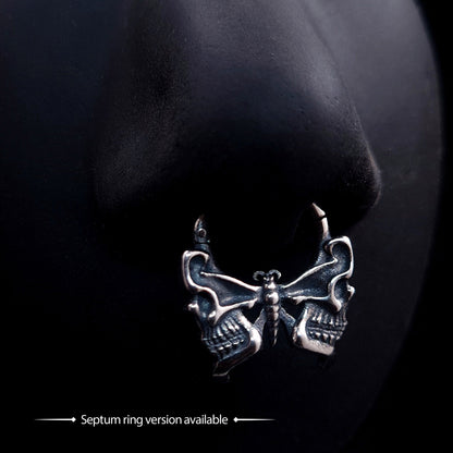 RBZ Jewelry Sterling silver Gothic Butterfly Skull septum clicker ring displayed on a black nose mannequin, featuring the signature macabre Memento Mori design with wings intricately sculpted into human skull profiles.