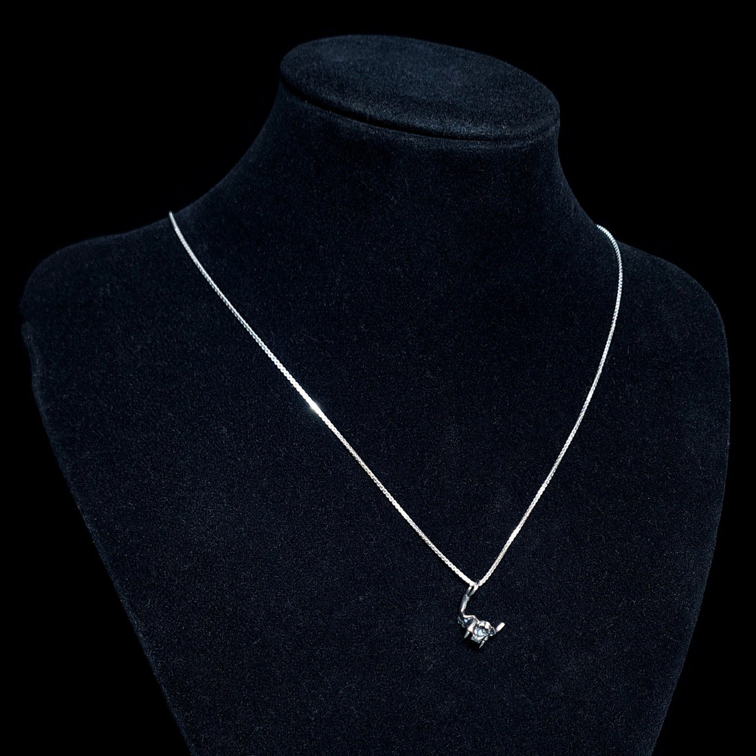 RBZ Jewelry Sterling silver Gothic Cat Skull Jawbone pendant on a silver chain, displayed on a black jewelry mannequin bust to show the pendant's hang and scale.
