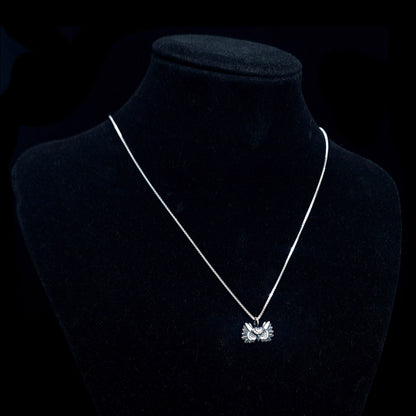Oxidized sterling silver Gothic Moon Owl pendant by RBZ Jewelry, featuring a crescent moon crown and detailed plumage, worn on a silver chain and displayed on a black mannequin bust against a dark background.
