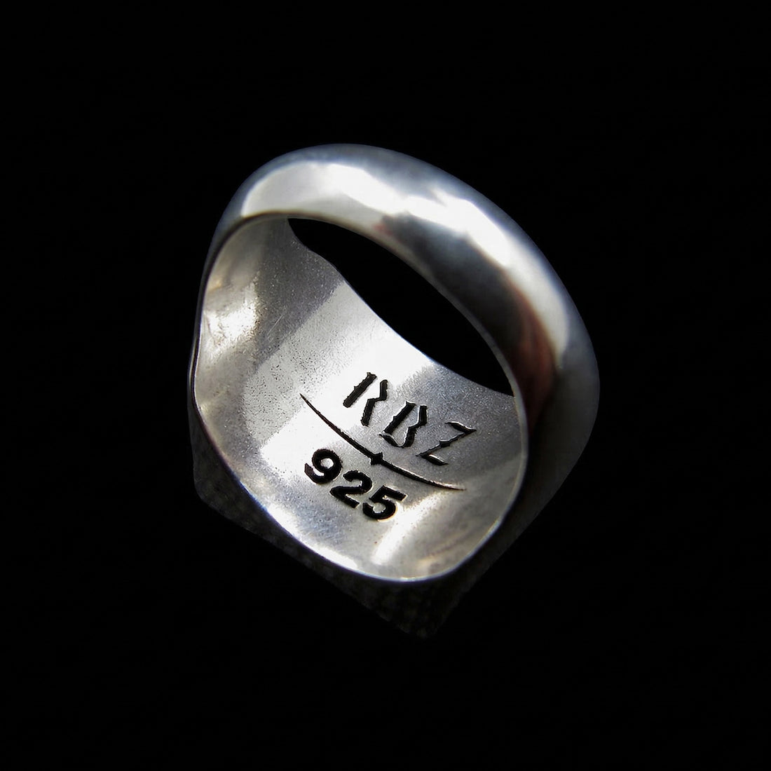 Interior macro view of the Sterling silver Plague Doctor signet ring by RBZ Jewelry, showcasing the polished inner band with the RBZ brand logo and 925 hallmark stamp.