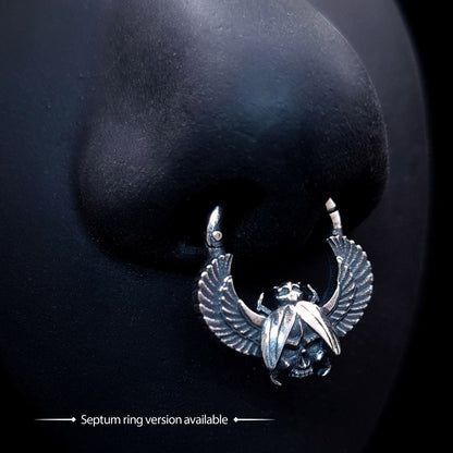 Sterling silver Gothic Egyptian Skull Scarab septum clicker ring by RBZ Jewelry, shown worn on a black mannequin nose against a dark background, with text indicating that a septum ring version is available.