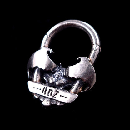 A back view of the RBZ Jewelry Gargoyle Guardian septum ring, featuring the RBZ logo engraved on the reverse sterling silver banner, showcasing the rear detail of the gothic gargoyle wings and the clicker hinge mechanism against a solid black background.
