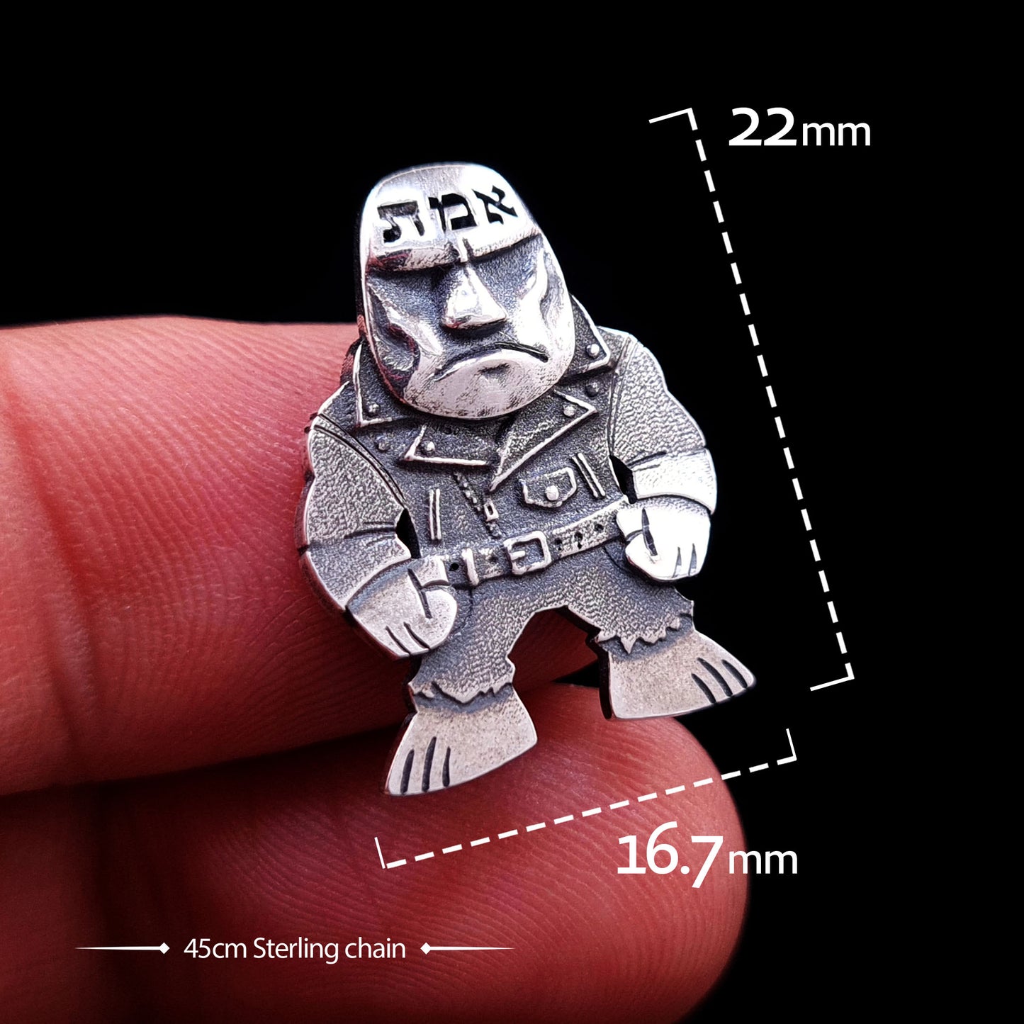 Dimensions and size reference for the RBZ Jewelry sterling silver Golem of Prague pendant, measuring 22mm in height and 16.7mm in width. The image shows the punk-rock guardian pendant held for scale against a finger, with text specifying it includes a 45cm sterling silver chain.