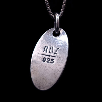 Reverse view of the Hecate Goddess pendant showing the official RBZ logo and 925 sterling silver hallmark stamp on a matte, oxidized silver finish
