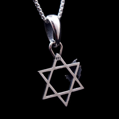 Back view of the sterling silver Bats Star of David pendant by RBZ Jewelry, showing the RBZ designer hallmark stamped on the top point of the Magen David, isolated on a black background.