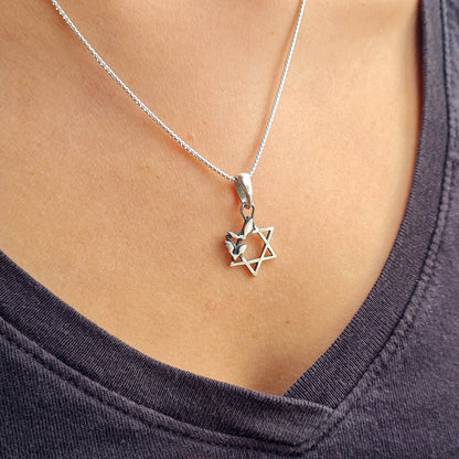 Sterling silver Bats Star of David pendant from the RBZ Jewelry Gothic Judaica collection, worn by a model on a silver chain to show length and placement.