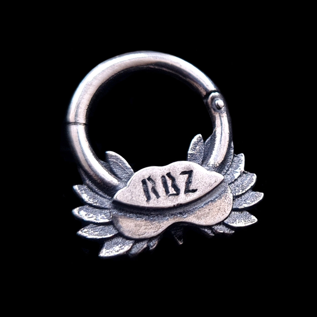 Back view of the Sterling silver Moon Owl septum ring by RBZ Jewelry, showcasing the RBZ brand engraving on the reverse side of the handcrafted owl design. The oxidized silver septum clicker is displayed against a solid black background.