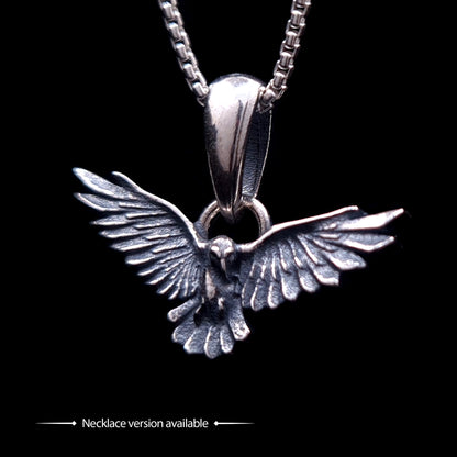 Sterling silver Dark Raven pendant by RBZ Jewelry, showcasing the detailed bird in flight with outspread wings and an oxidized finish, hanging from a silver chain to demonstrate the necklace version of the design.