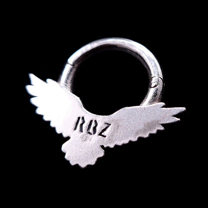 Back view of the Sterling silver Dark Raven septum ring by RBZ Jewelry, showing the brand's RBZ logo engraving and the clicker hinge mechanism against a black background.