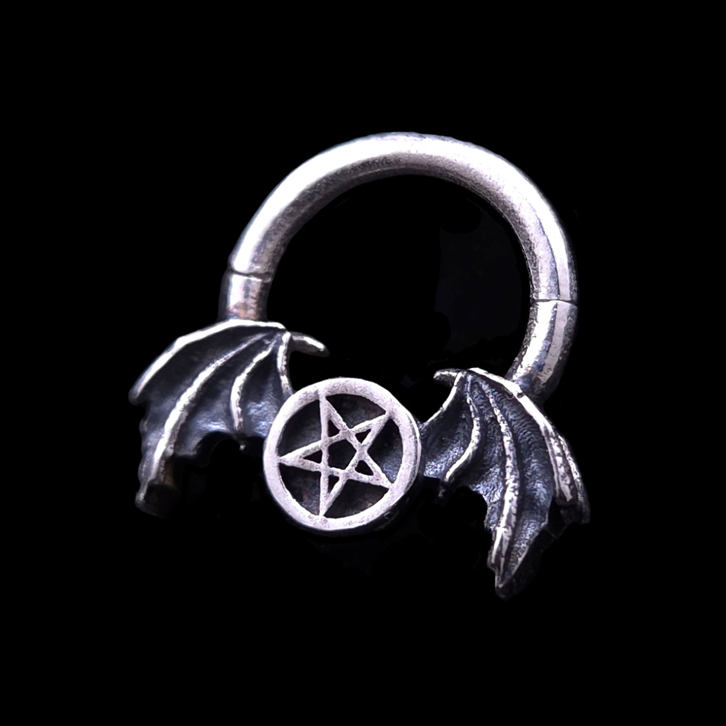 Gothic 925 sterling silver septum clicker ring by RBZ Jewelry, featuring an intricately detailed pentagram flanked by oxidized demon bat wings.