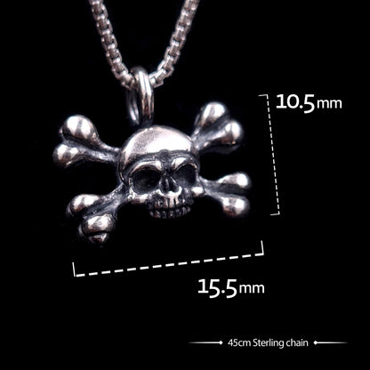 Sterling silver Gothic skull and crossbones pendant by RBZ Jewelry with graphic dimensions showing 10.5mm height and 15.5mm width, paired with a 45cm sterling silver chain.