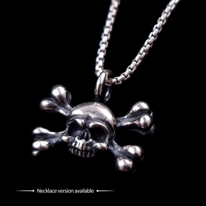 Hand-crafted sterling silver skull and crossbones pendant necklace by RBZ Jewelry, featuring a weathered, oxidized finish and detailed gothic memento mori design on a box chain against a solid black background.