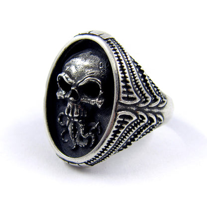 RBZ Jewelry Sterling Silver Tentacle Skull Signet Ring on a white background, showcasing the side profile with high-relief skull detailing and intricate bio-organic textured carvings on the band.