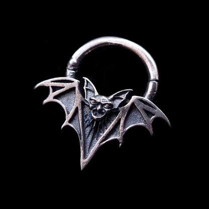 Sterling silver Gothic vampire bat septum clicker ring by RBZ Jewelry, featuring a detailed bat face and skeletal wings with a deep oxidized finish against a black background.