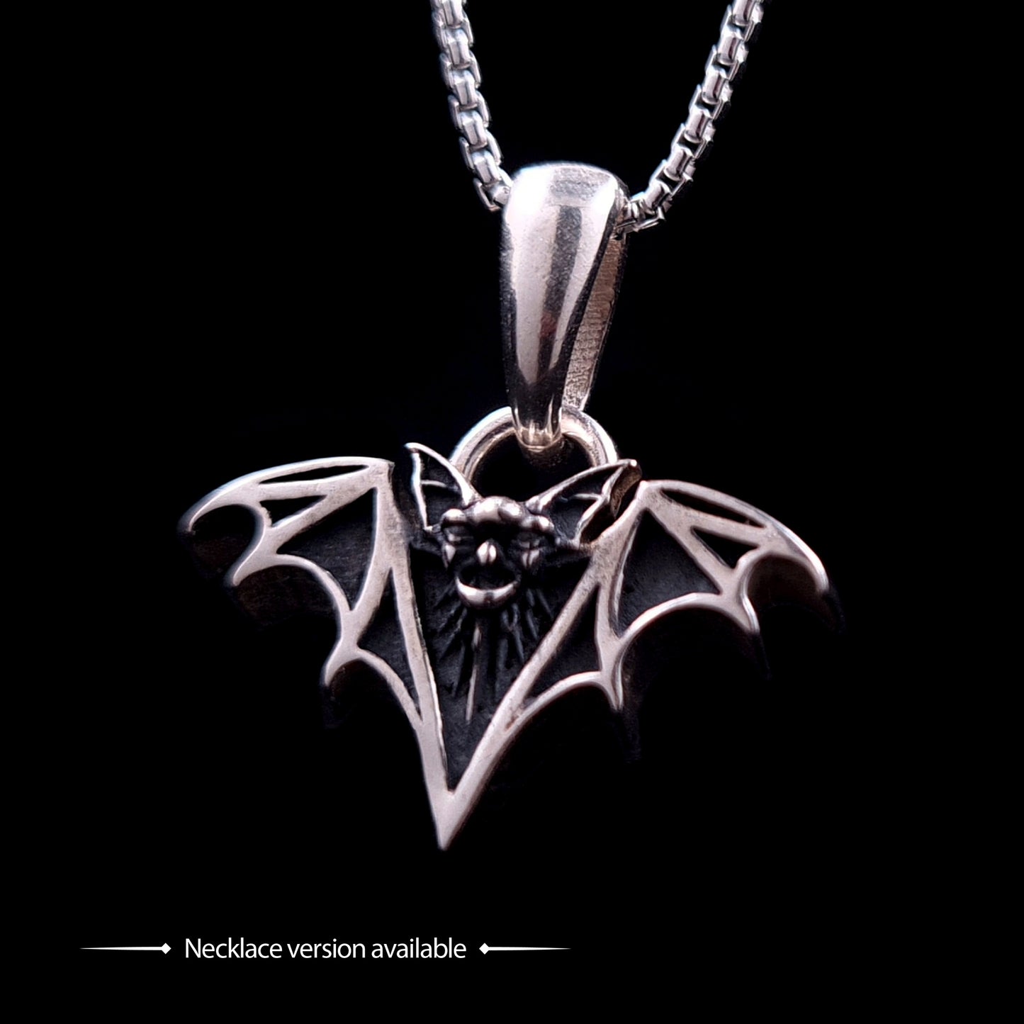 Sterling silver Gothic vampire bat pendant necklace by RBZ Jewelry, featuring the detailed oxidized bat design on a silver chain against a black background, with "Necklace version available" text.
