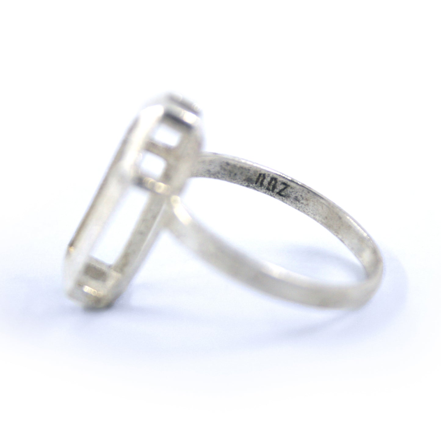 Close-up of the RBZ brand logo stamp on the inner band of the Sterling silver Minimalist Coffin ring, showcasing the authentic mark of RBZ Jewelry.