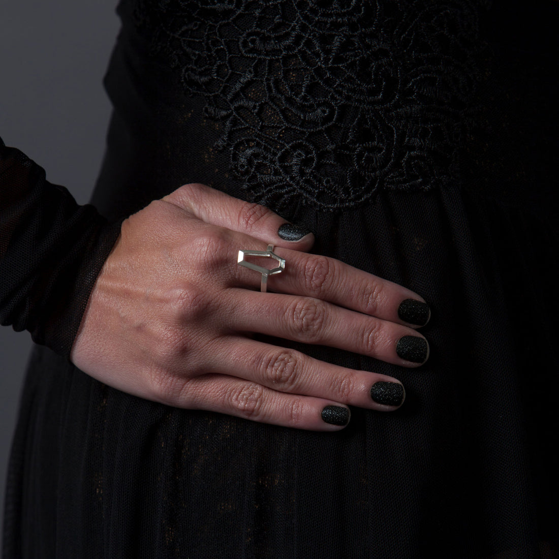 RBZ Jewelry Sterling silver Minimalist Coffin ring worn by a Gothic female model, showcasing the hollow geometric design and architectural frame against the skin.