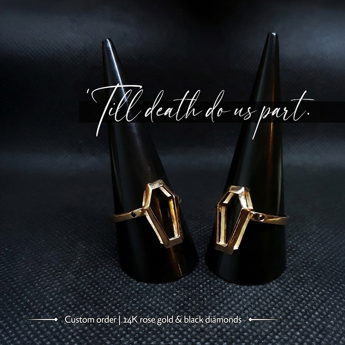 Pair of custom 14K rose gold Minimalist Coffin engagement rings by RBZ Jewelry, featuring black diamond accents and hollow geometric frames on black mandrels with the text "'Till death do us part."