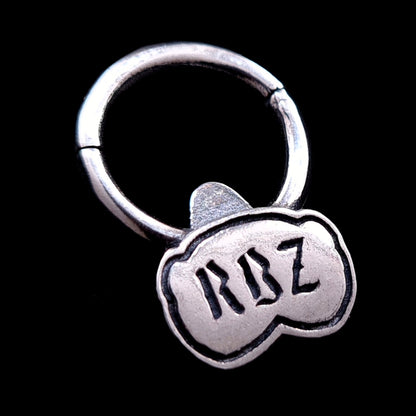 Back view of the sterling silver Jungle Gorilla septum clicker ring by RBZ Jewelry, showing the RBZ brand logo engraved on the reverse side of the polished gorilla bust against a black background.
