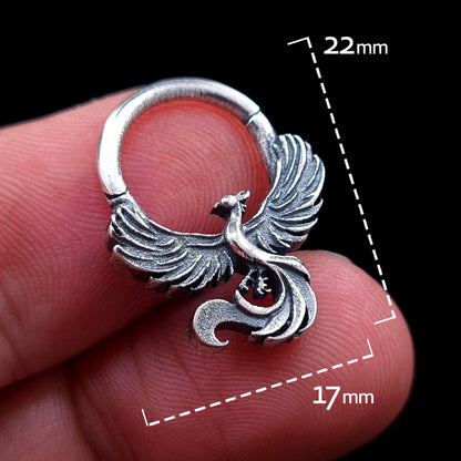 Sterling silver Soaring Phoenix septum ring by RBZ Jewelry held in hand, with graphic overlays indicating its dimensions of 22mm in height and 17mm in width, emphasizing the scale and detailed craftsmanship of the piece.