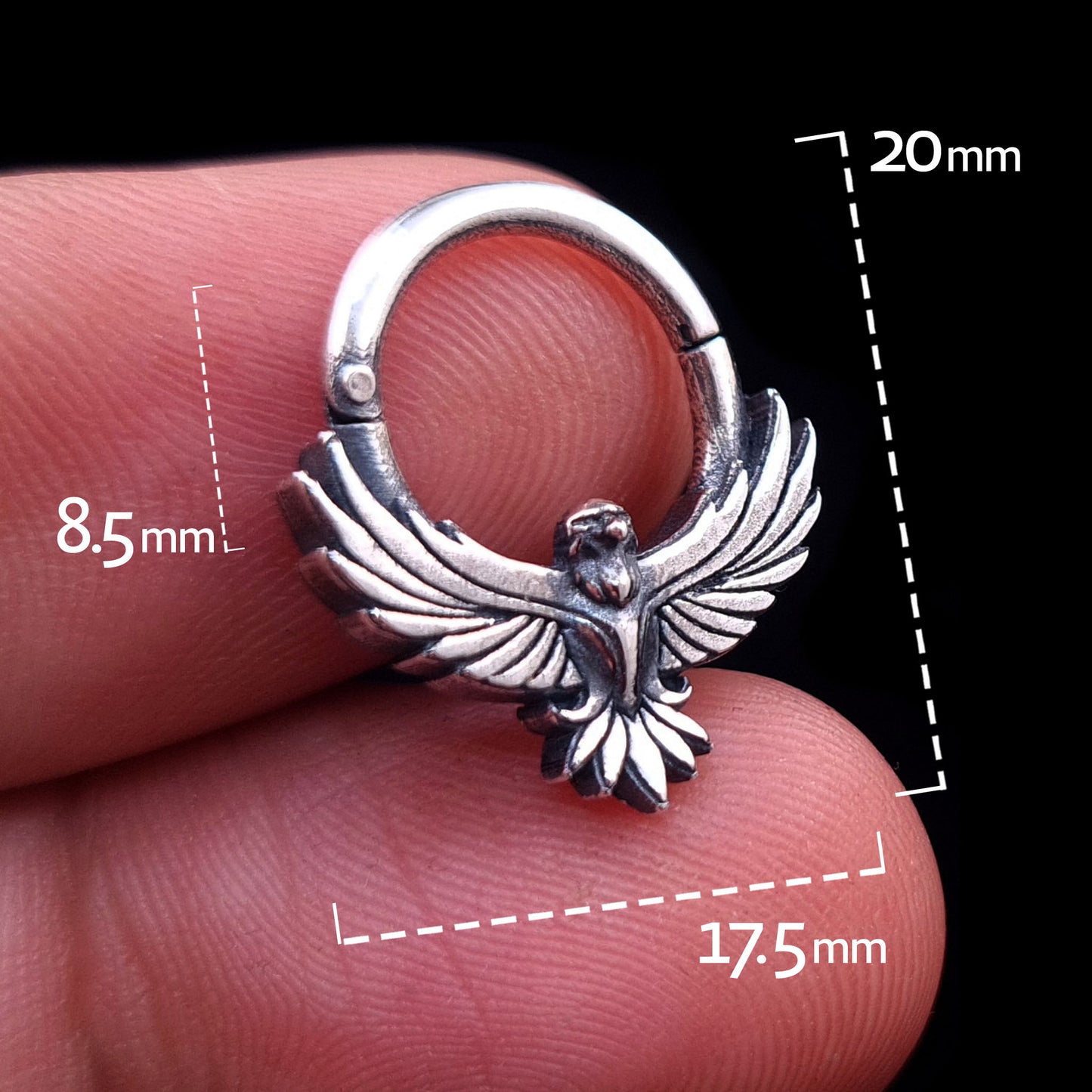 Sterling silver Tribal Eagle septum ring by RBZ Jewelry held in hand, with graphic overlays showing dimensions: 8.5mm inner drop, 17.5mm width, and 20mm total height.