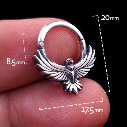 Sterling silver Tribal Eagle septum ring by RBZ Jewelry held in hand, with graphic overlays showing dimensions: 8.5mm inner drop, 17.5mm width, and 20mm total height.