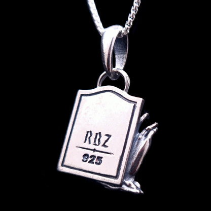 Back view of the sterling silver Zombie Star of David pendant, featuring a tombstone shape engraved with the RBZ Jewelry logo and the 925 sterling silver hallmark. The detailed decaying zombie hand is visible from the side, emphasizing the gothic craftsmanship of the piece.