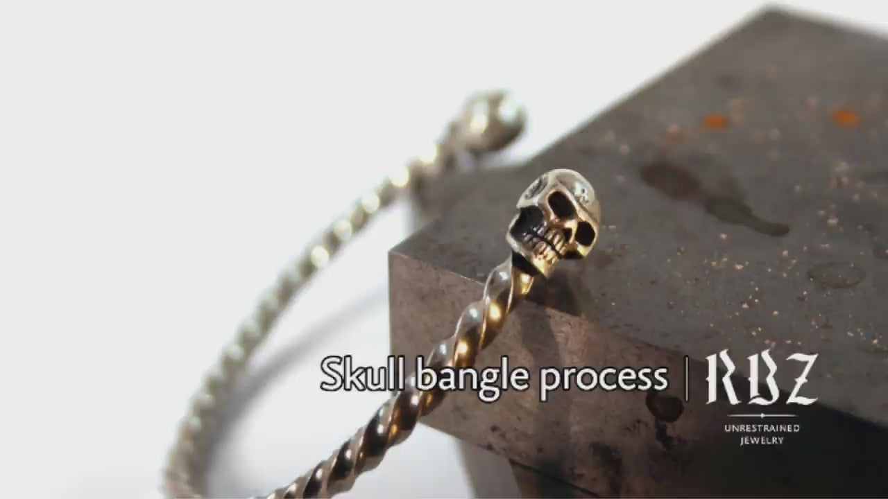 Load video: Creating a skull bangle | by RBZ